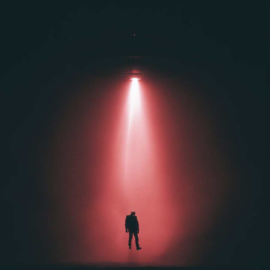 A person suspended in mid-air, illuminated by a red light beam coming from above in a dark space