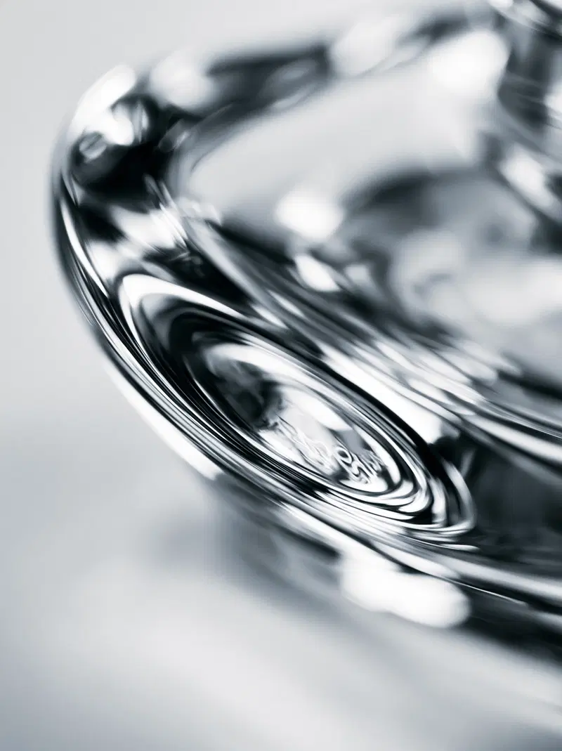 Close-up photograph capturing abstract details of a reflective glass object