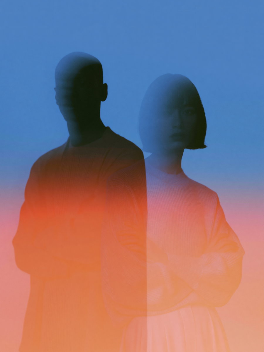 A double exposure image featuring two people with a blue and orange gradient overlay creating an abstract effect