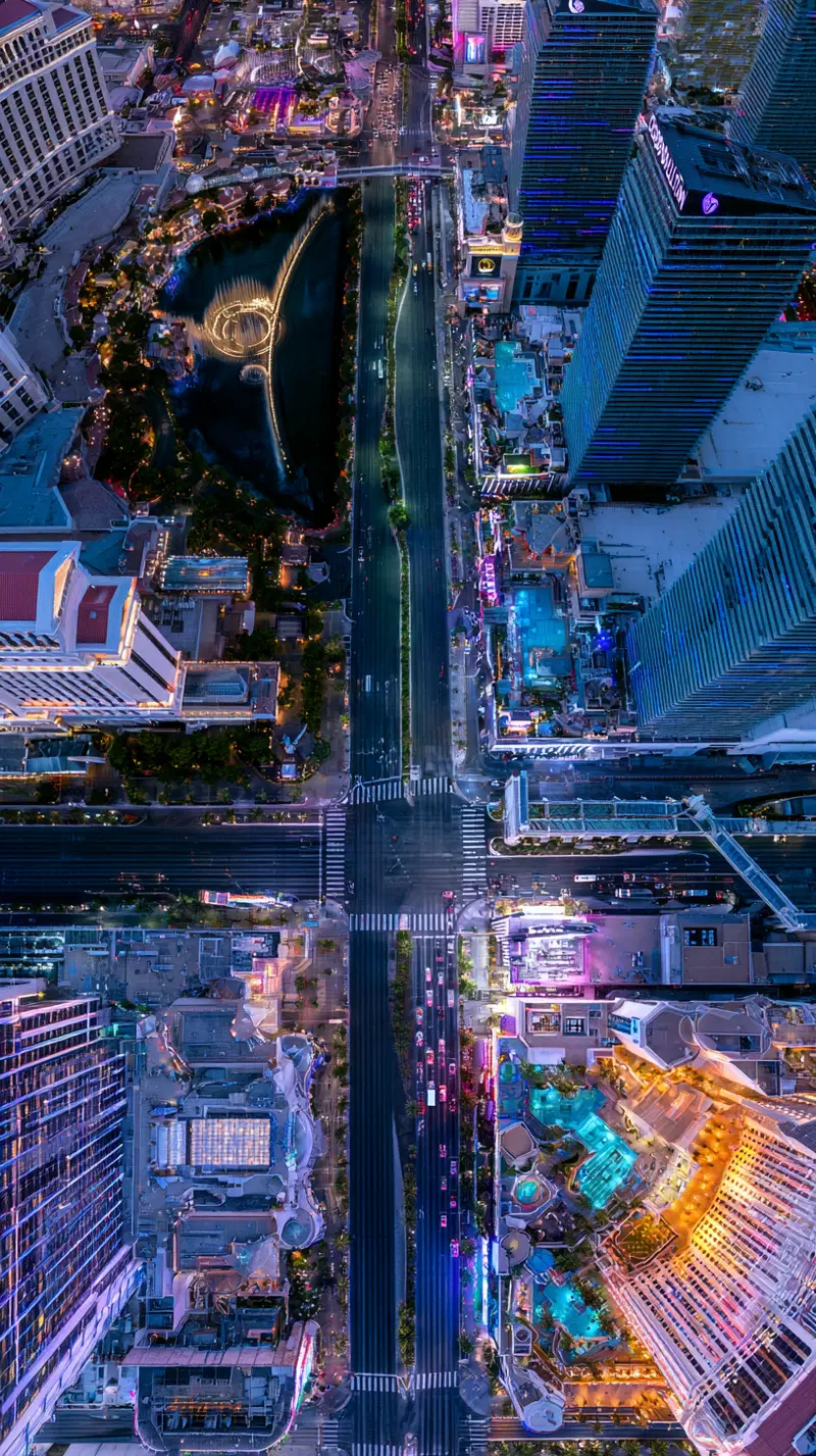 Aerial night view of urban cityscape with illuminated buildings and streets