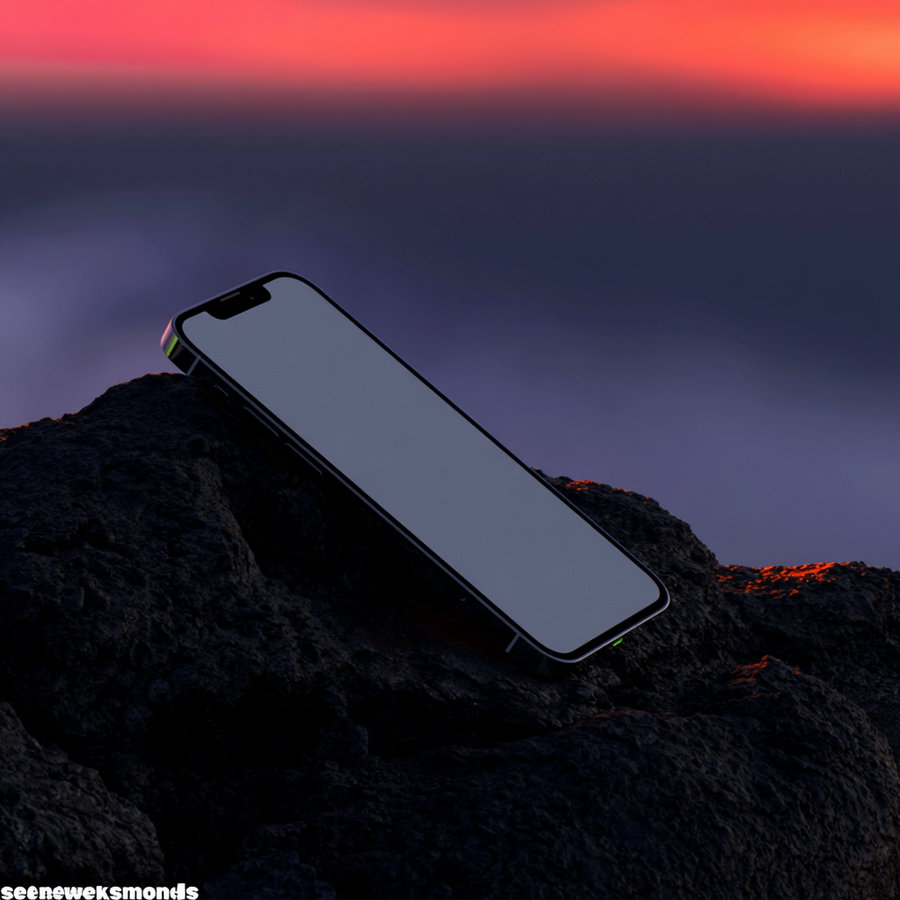 A modern smartphone with a blank screen placed on dark rocks with a vibrant red and purple sunset sky in the background