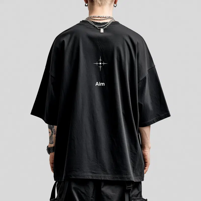 Minimalist black graphic T-shirt design with text and target symbol