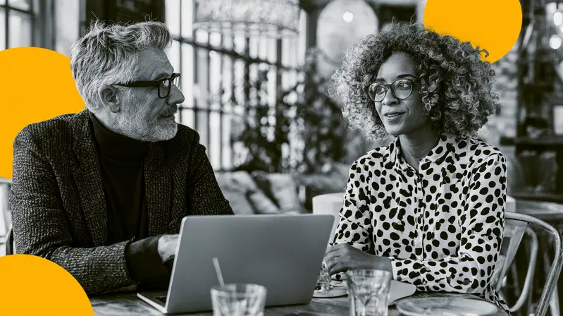 Black and white photo of business people discussing work with yellow art elements