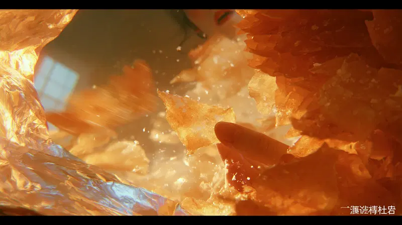 Macro perspective of a hand holding translucent orange flakes inside a foil