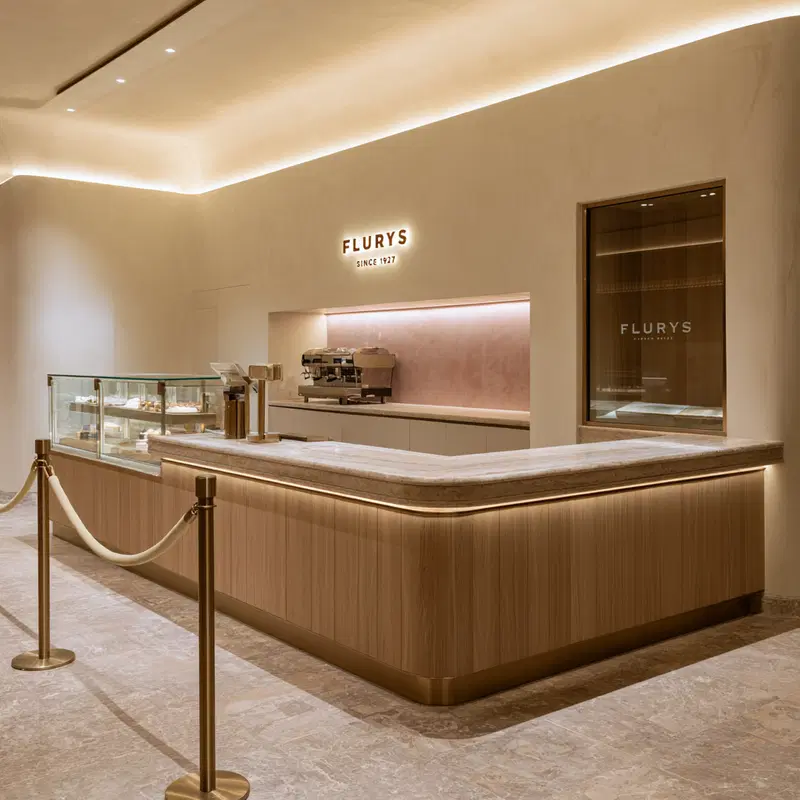 Minimalist coffee shop interior design with warm lighting and wood accents