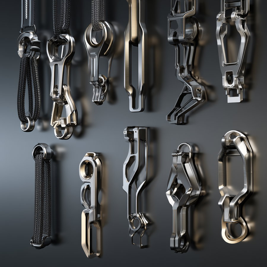 Various modern metallic abstract shapes with reflective surfaces hanging against a dark wall background