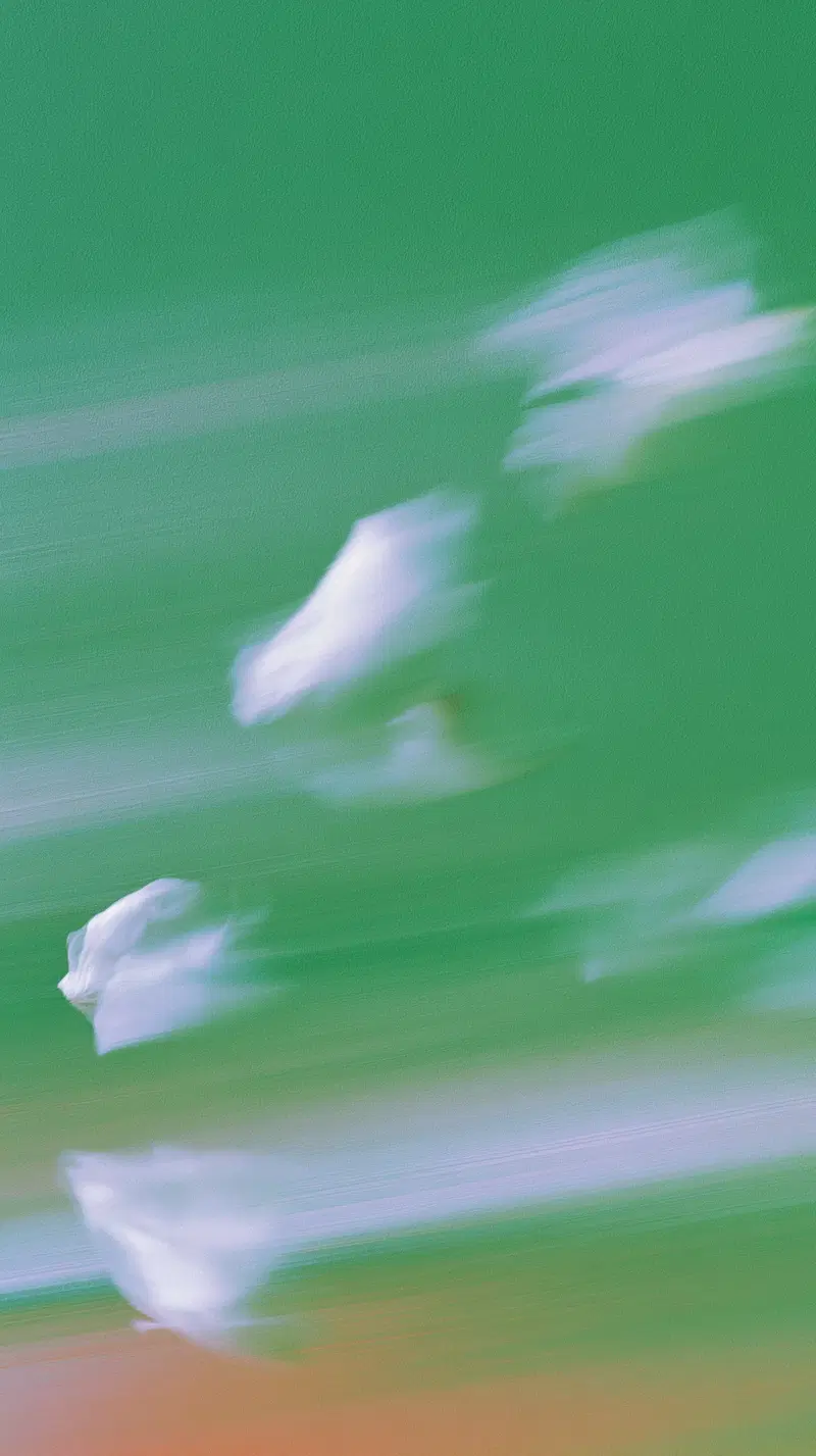 Abstract motion blur art with white and green soft streaks