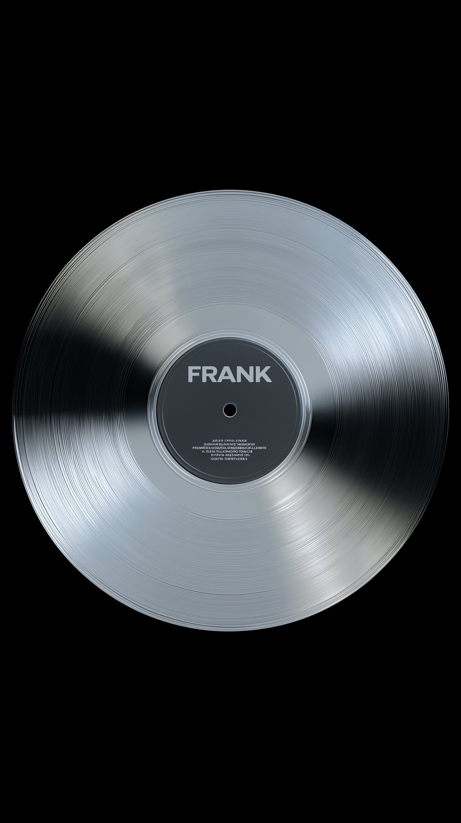 A shiny silver vinyl record with grooves and a central label that reads FRANK, displayed on a black background.