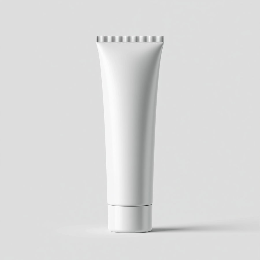 A white cosmetic tube with a screw cap standing upright against a plain light gray background