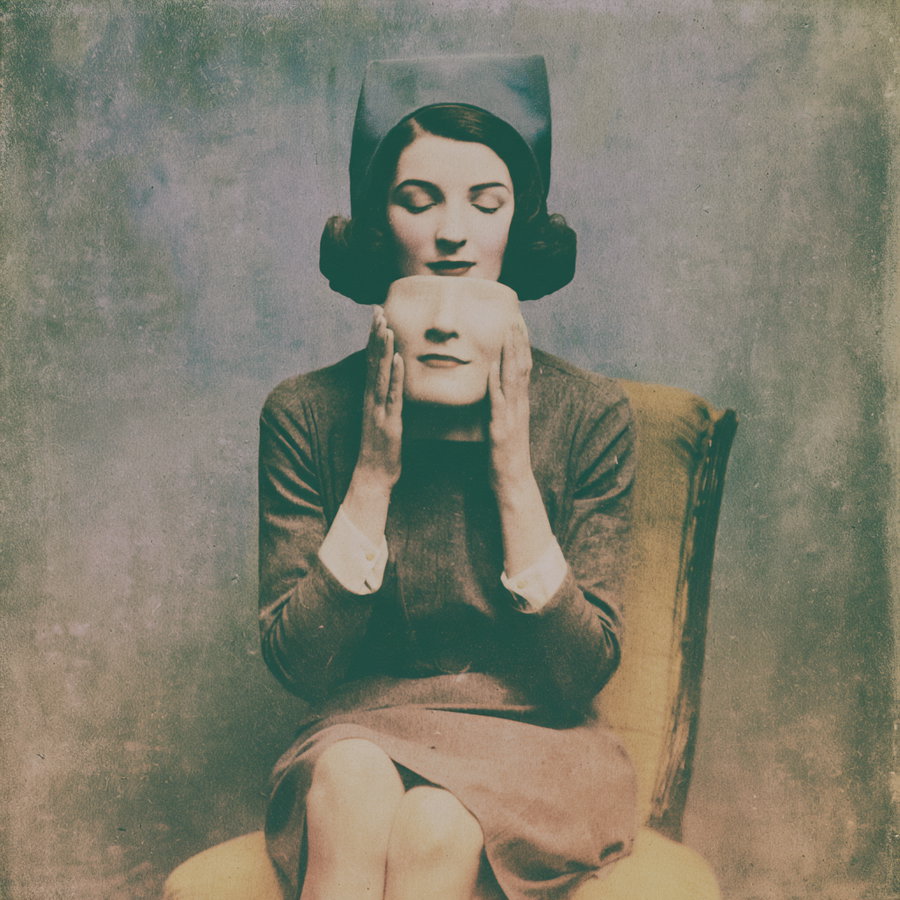 A vintage style surreal image of a woman sitting on a chair holding a detached face mask with closed eyes, wearing a hat and dress against a muted textured background