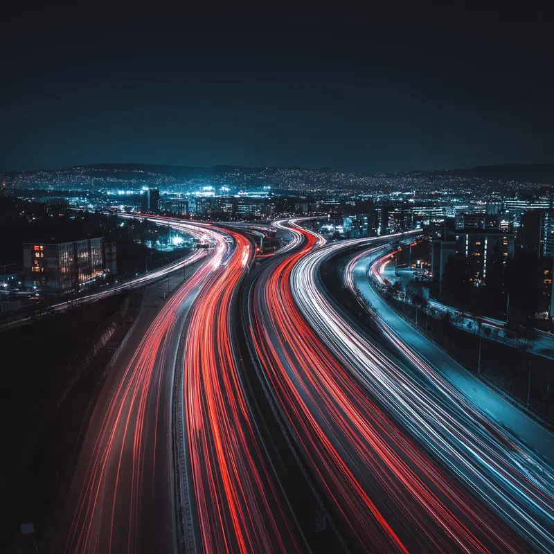 Long exposure photograph capturing vibrant city highway lights at night