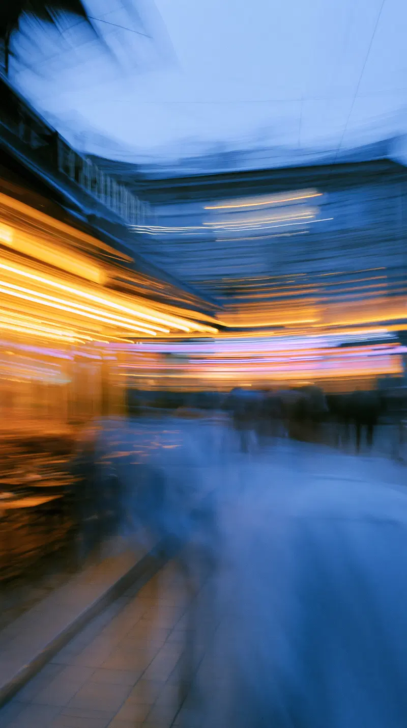 Abstract cityscape with dynamic light trails and blurred movement