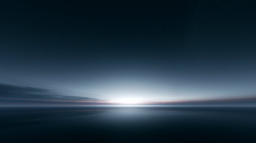 A tranquil ocean view under a dark blue sky with a soft, glowing light on the horizon and thin clouds stretching across the sky