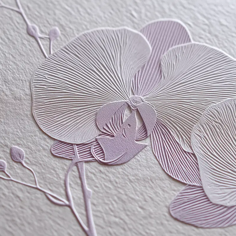 Detailed embossed floral artwork featuring a close-up of delicate orchid petals
