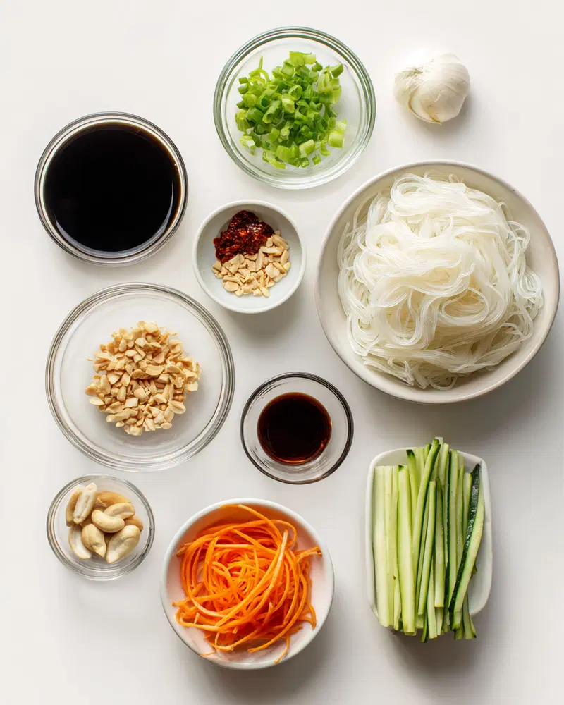 Overhead view of fresh ingredients and seasonings neatly arranged for cooking