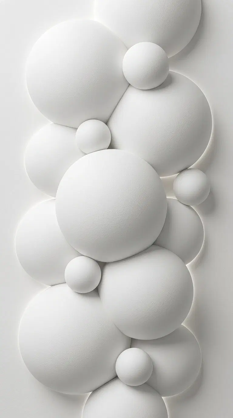 Minimalist wall art featuring textured white 3D spherical shapes in a harmonious arrangement