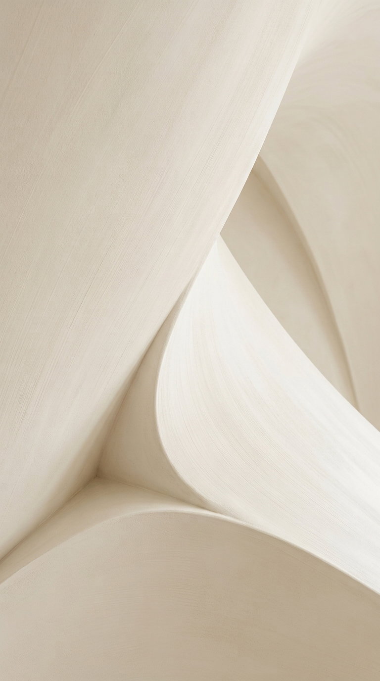 close-up photo of smooth, cream-colored curved architectural surfaces with soft shadows and textured finish