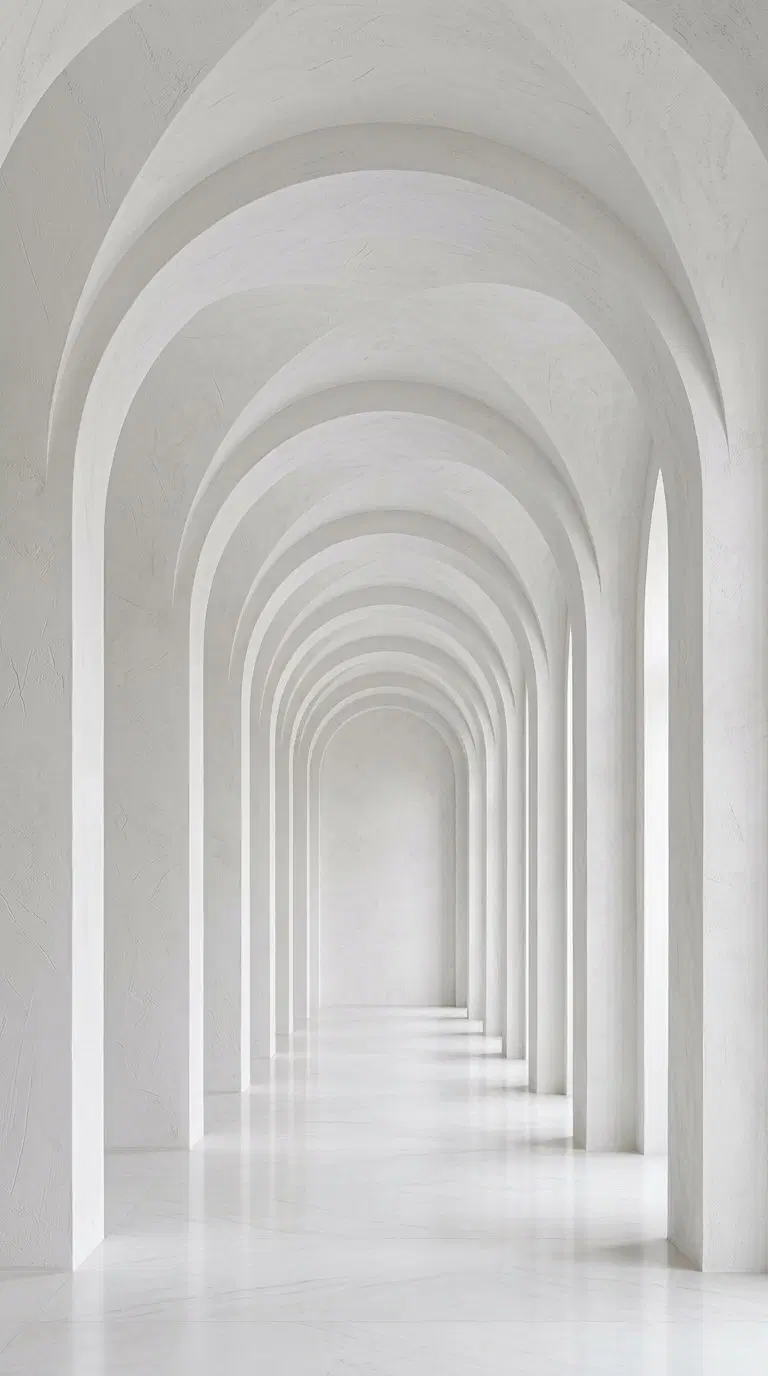 Minimalist white arched corridor with textured walls and smooth floor