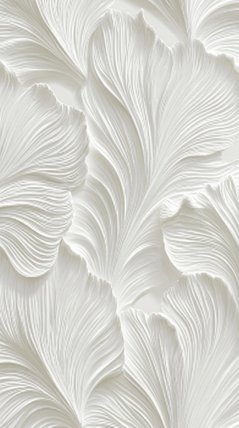 Close-up of textured white minimalist wall art with intricate leaf-like patterns and delicate grooves