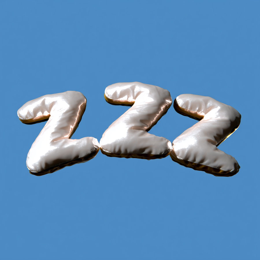 Three shiny metallic balloons shaped as the letter Z arranged in a row on a blue sky background