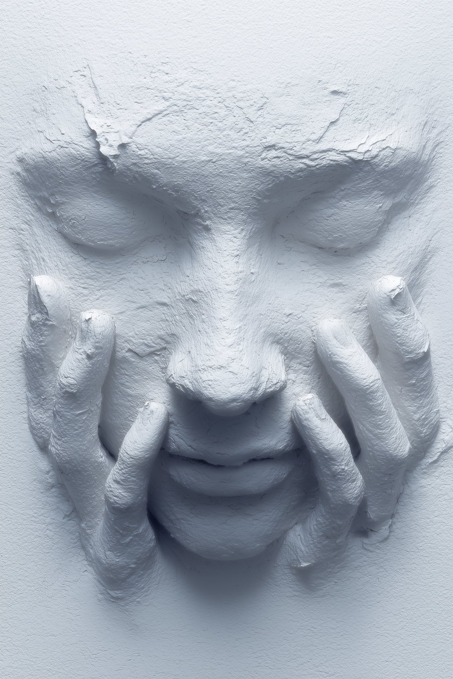 A white textured wall sculpture featuring a face with closed eyes and hands pressed against the cheeks