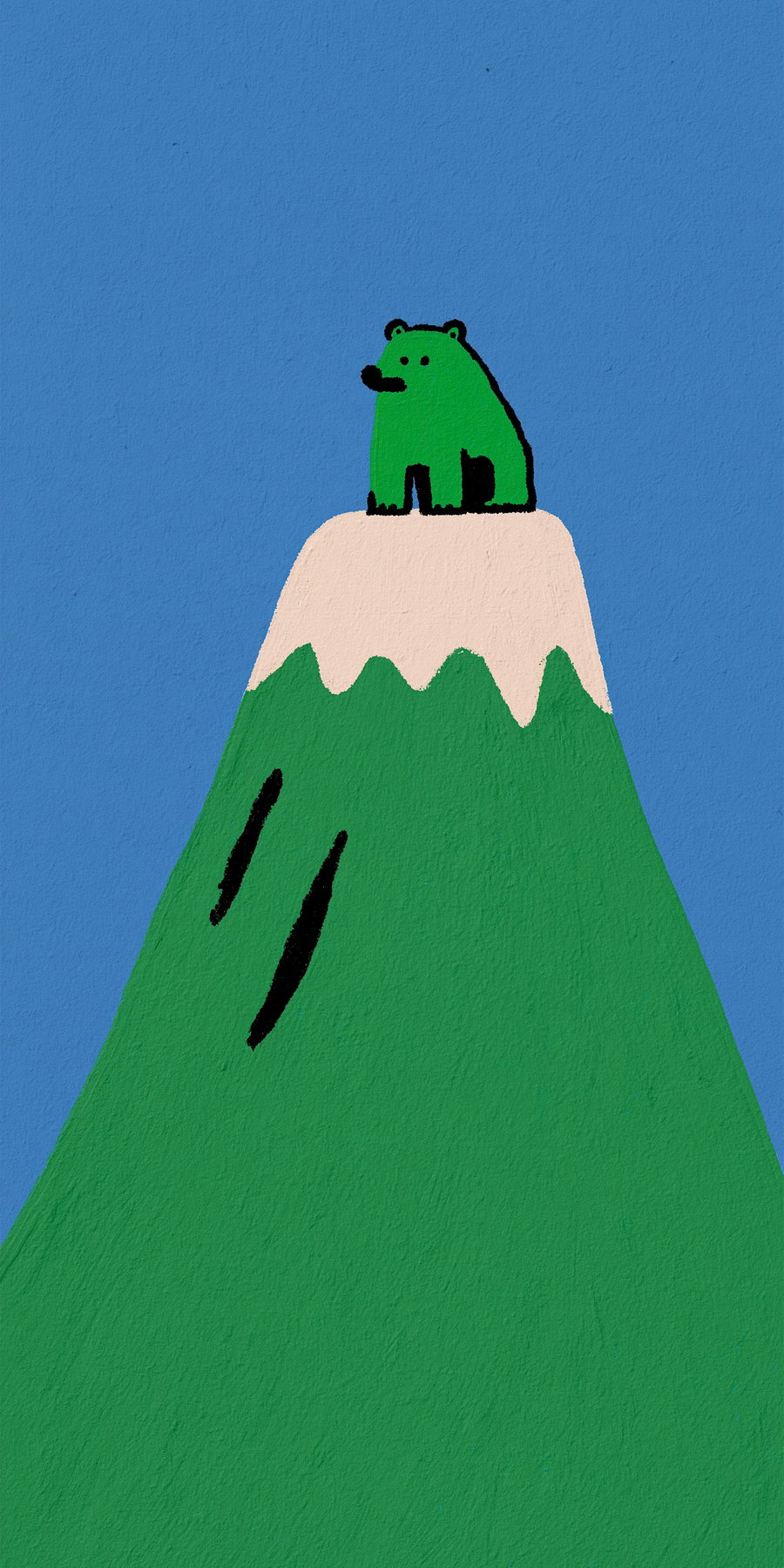 A small bear sitting on a green mountain peak with a white snowy top, under a clear blue sky.