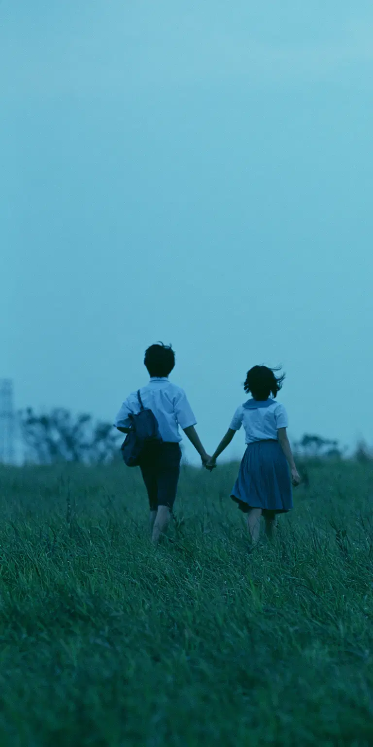 Japanese Boy and Girl Walking Hand in Hand in a Dreamy Landscape