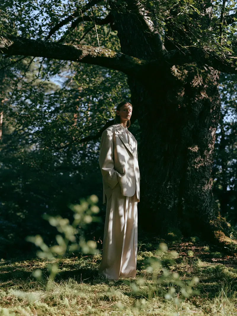 High-End Fashion Editorial Under a Large Tree in a Woodland Setting