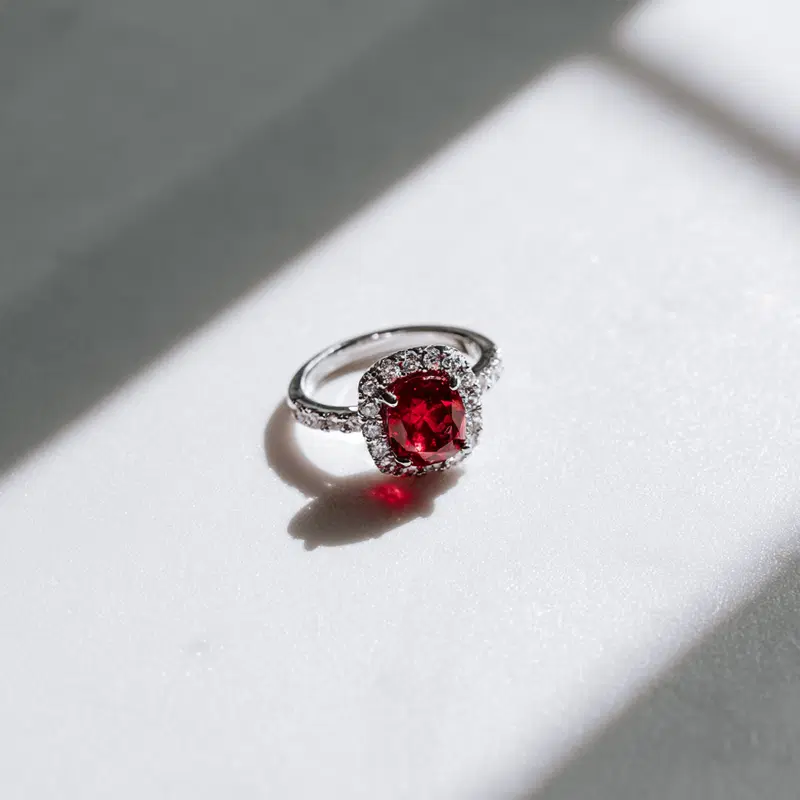 Elegant Ruby Diamond Ring on a Classic White Table
