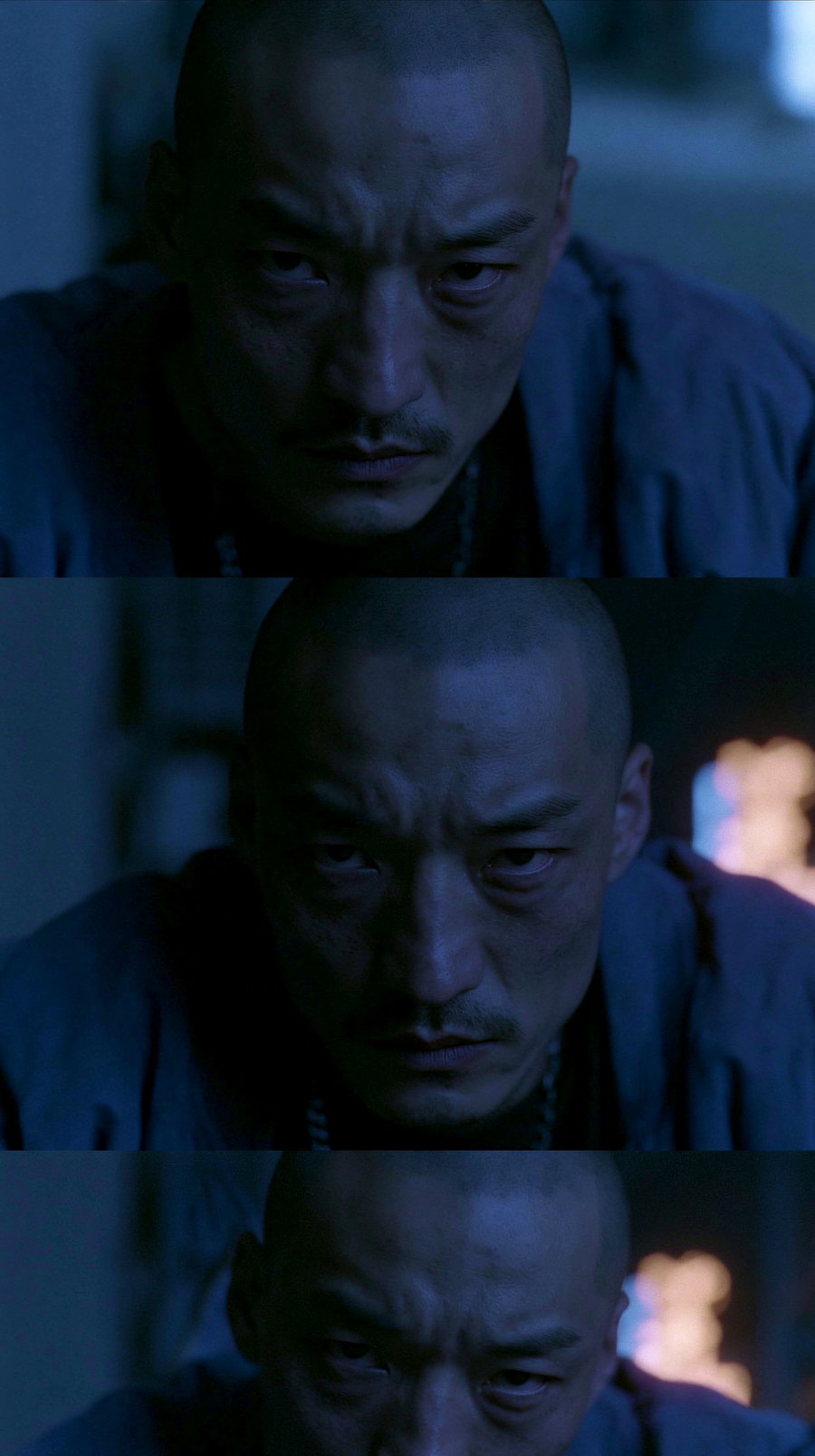 Medium shot portrait of a young male with a golden buzz cut, wearing a loose bomber jacket, sitting in an urban night setting with blue and warm orange neon lighting. His expression is intense and aggressive, capturing a threatening aura.