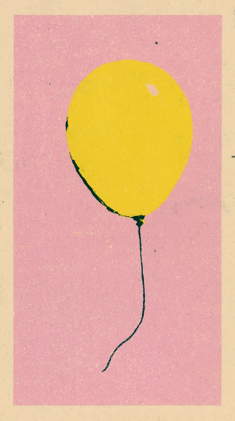 Single Yellow Balloon Floating on Textured Background